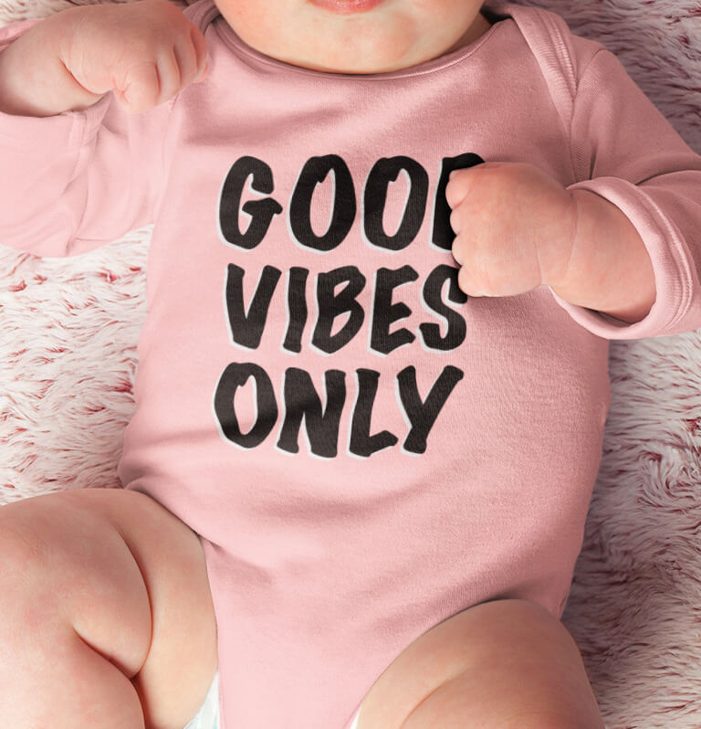Baby wearing solid color printed pink long sleeve onesie